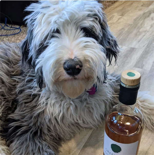 Diesel posing next to a bottle